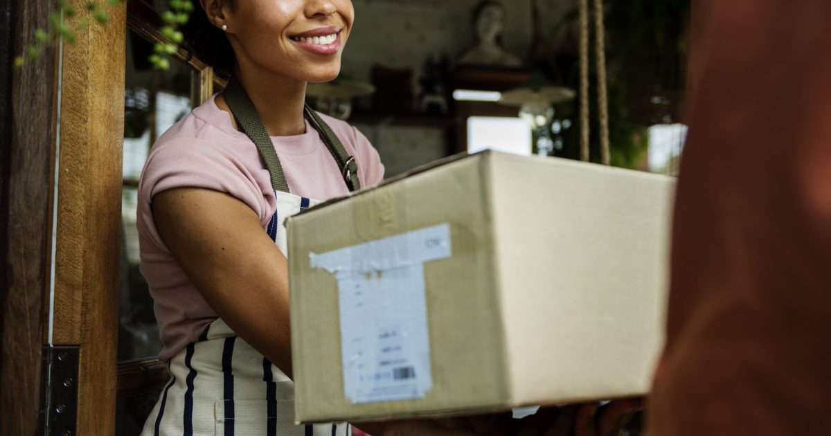 Man Deliver Mail Box to Woman in front of Stop