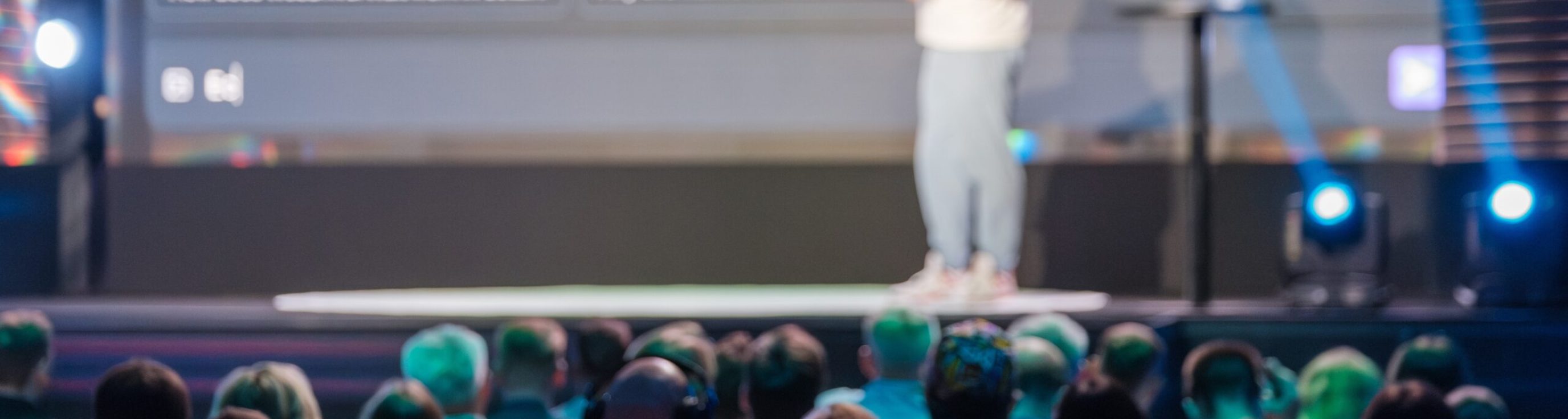 Speaker,Giving,A,Presentation,At,A,Business,Conference.,Engaged,Audience