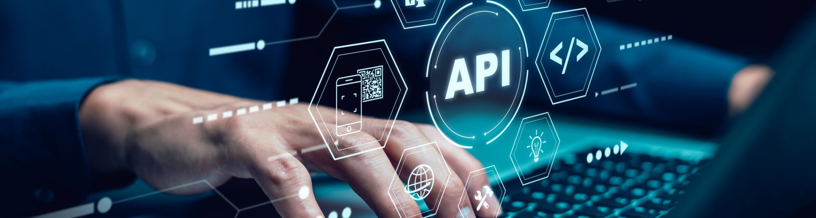 Businessman,Using,Laptop,With,Api,Icon,On,A,Virtual,Screen